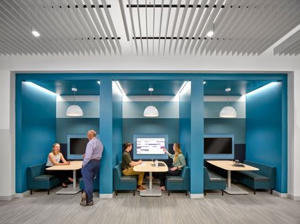 Booths with tables and TV screens
